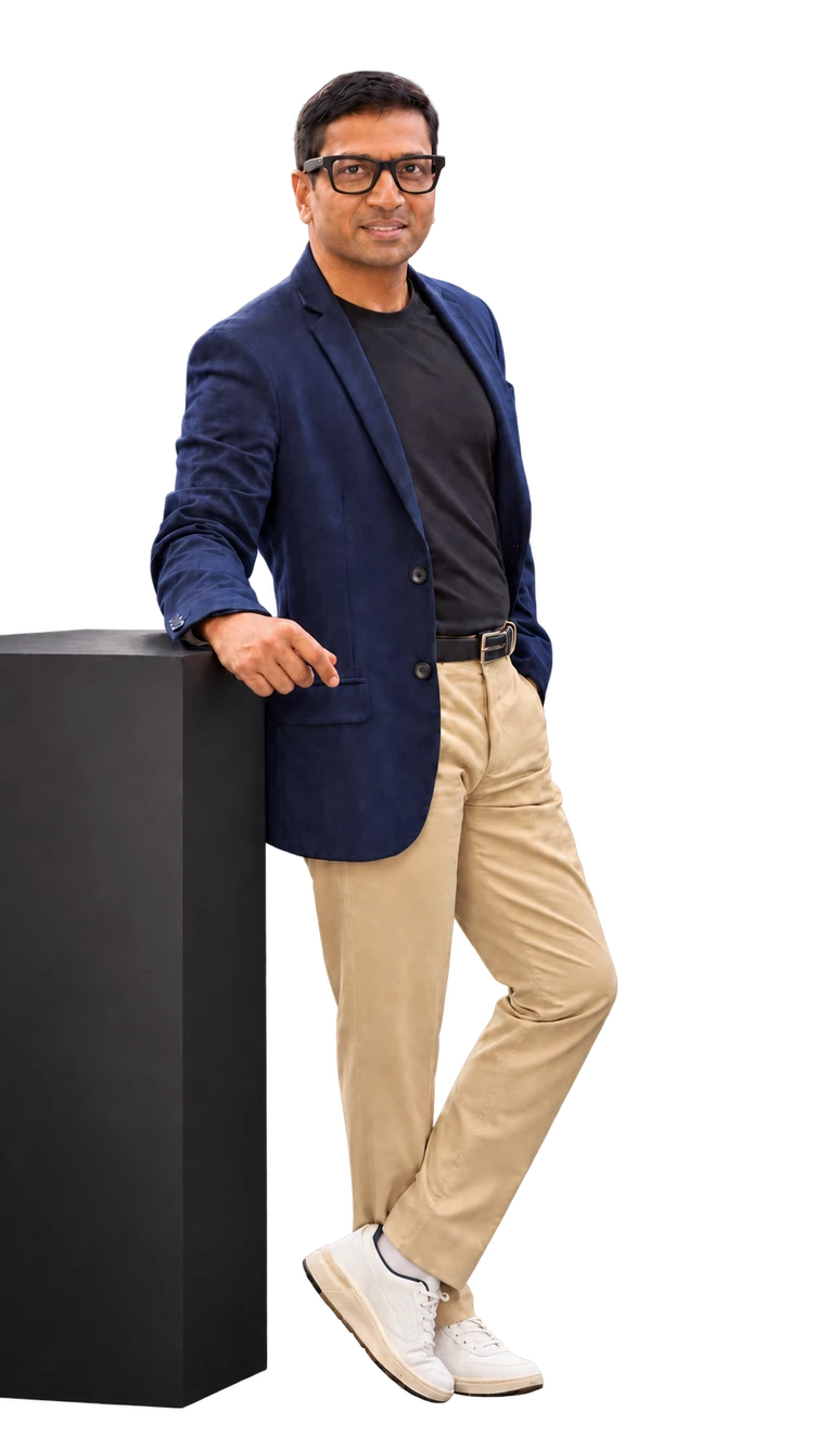 Gautam Mandal in a navy jacket, leaning on a plinth